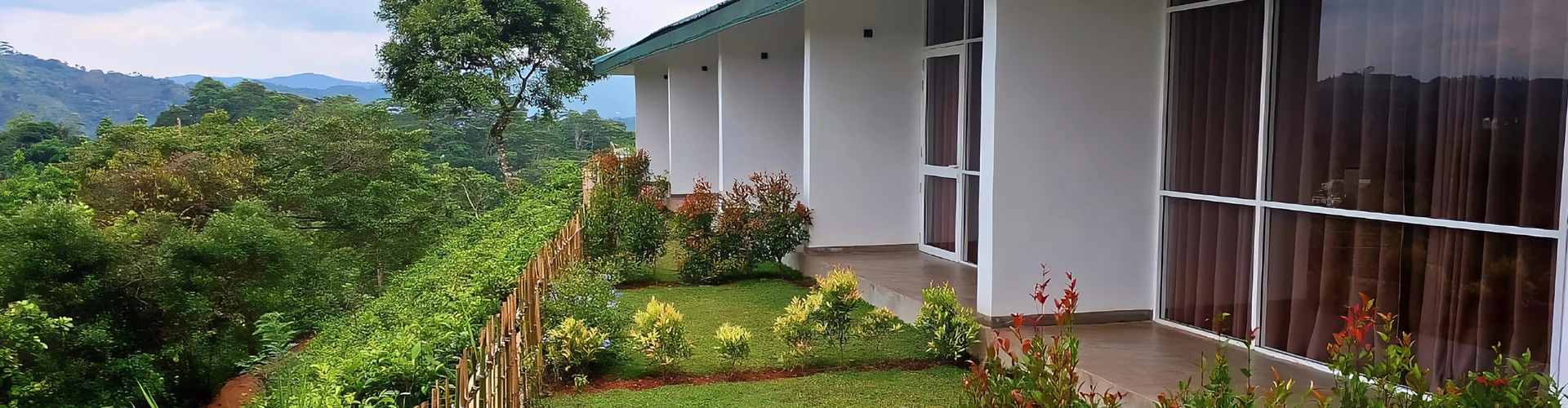 A picturesque balcony scene featuring stunning mountains and lush greenery, inviting tranquility and natural beauty